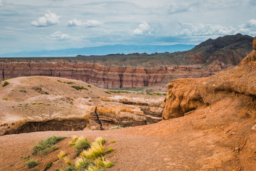 view of the canyon against a cloudy, stormy sky