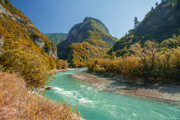 Mountain river flows in a mountain valley.