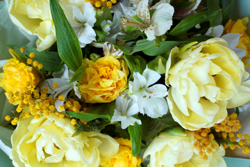 Exquisite delicate bouquet of yellow and white flowers