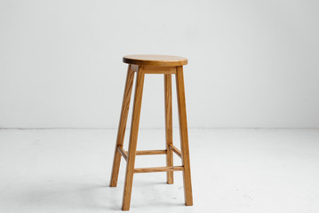 Wooden chair in a white empty room