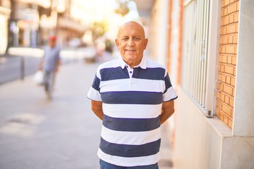 Senior handsome man smiling happy and confident. Standing with smile on face at town street