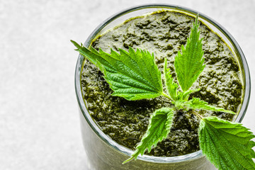 Detox juice or green smoothie, healthy drink with leaves of nettle