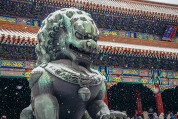 Traditional lion sculpture in front of Gate of Supreme Harmony in Forbidden City, main tourist...