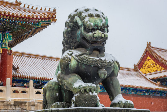 Traditional lion sculpture in front of Gate of Supreme Harmony in Forbidden City, main tourist attraction in Beijing, capital city of China
