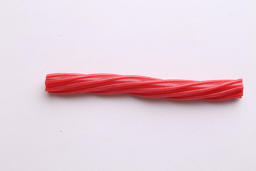 sweet red gummy licorice in color background