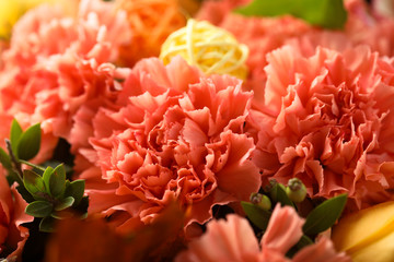 Yellow and orange roses bouquet on a rustic wooden background 