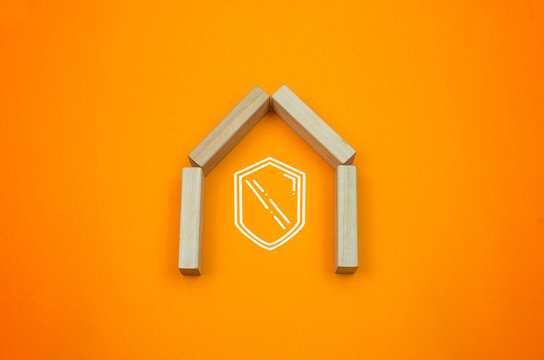 house insurance concept design drawing element with photo wooden blocks on the orange yellow gradient background 
