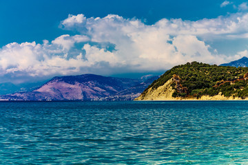 Fototapeta na wymiar Beautiful Ionian Sea with clear turquoise water and morning summer coast view from beach Lukove, southern Albania.