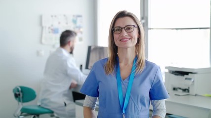 A portrait of dental assistant and dentist in modern dental surgery. - Powered by Adobe