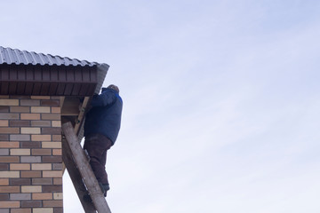builders work at height at a construction site