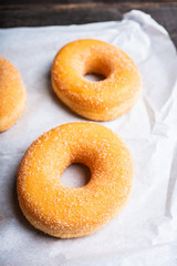 Donut with apple jam on the rustic background. Selective focus.