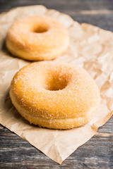 Donut with apple jam on the rustic background. Selective focus.