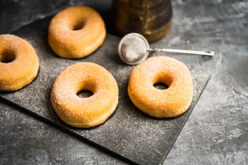 Donut with apple jam on the rustic background. Selective focus.