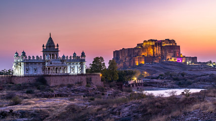Fototapeta na wymiar The Jaswant Thada and Mehrangarh Fort in background at sunset, The Jaswant Thada is a cenotaph located in Jodhpur, It was used for the cremation of the royal family Marwar, Jodhpur. Rajasthan, India