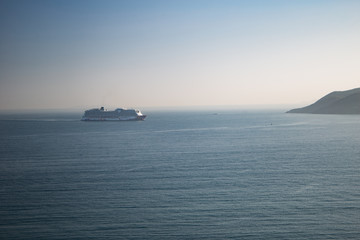 Fototapeta premium Cruise ship very far on the horizon