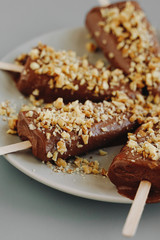Chocolate ice cream with nuts. Raw desserts