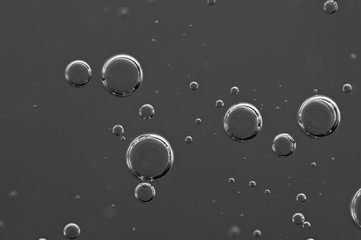  Dark background. Liquid with air bubbles for projects, oil, honey, beer, juice, shampoos. Black...