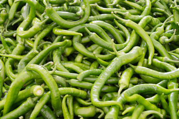 thin green chili peppers on the counter