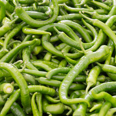 thin green chili peppers on the counter