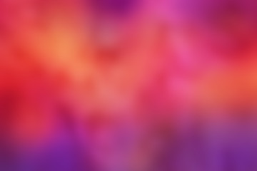 Soft, blurred background. Bright vibrant colors of purple, pink, orange, and red.