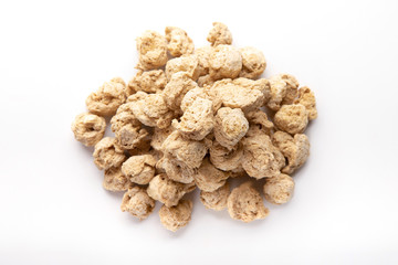 Heap of dry soy meat, isolated on white