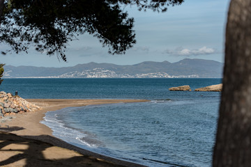 Platja de Les Muscleres in La Escala behind the ruins of Empuries, in the Province of Giron, Catalonia, Spain.