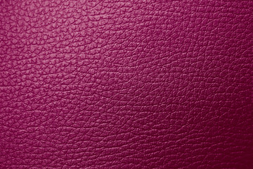 Fototapeta premium Texture of genuine leather maroon red magenta tone. Backdrop background textured effect for design. Artificial eco leather piece of artificial fake skin