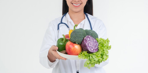 Doctor or nutritionist holding fresh fruit (Orange, red and green apples) and smile in clinic. Healthy diet Concept of nutrition food as a prescription for good health, fruit is medicine