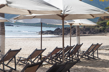 Under Umbrella On Beach On Summer Holidays Vacations