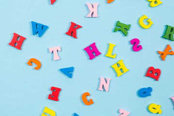 Multicolored letters on a blue background.