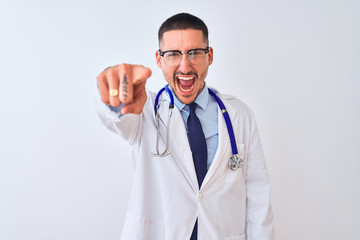 Fototapeta premium Young doctor man wearing stethoscope over isolated background pointing displeased and frustrated to the camera, angry and furious with you
