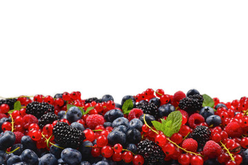 Blackberry, raspberry, blueberry,  red currant and mint background. Isolated on white. Copy space.