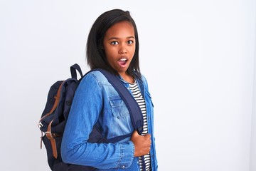 Young african american student woman wearing backpack over isolated background scared in shock with a surprise face, afraid and excited with fear expression