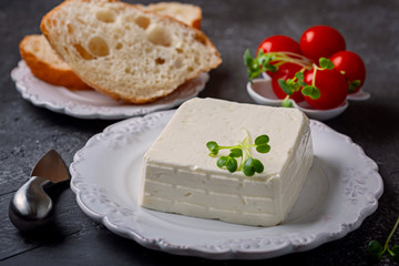 Ingredients for breakfast: cheese Stracchino,  tomatoes and bread