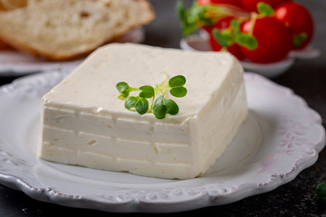 Italian cheese Stracchino,  prosciutto, tomatoes and bread