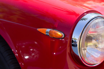 old red car turn signal closeup