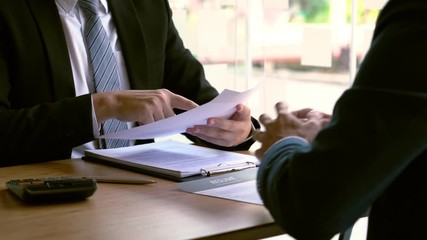 4k video of attractive man explaining about his profile to business managers during job interview, recruitment process