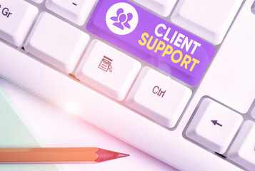 Writing note showing Client Support. Business concept for focus on helping customers to use products and services