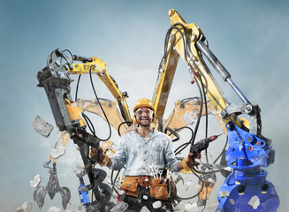 Construction worker in dirty clothes with a hammer and drill at work