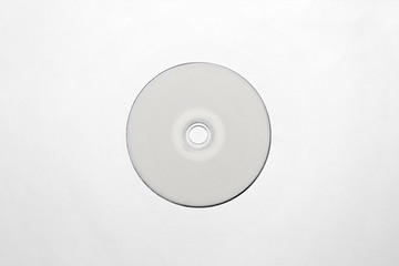 DVD or CD disc with white isolated blank for branding design. CD jewel mock-up on soft gray background. 