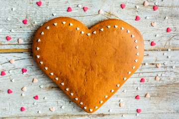 Homemade gingerbread heart on a wooden background. Valentine's Day.