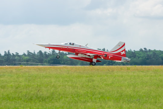 BERLIN, GERMANY - JUNI 02, 2016: Landing of jet Northrop F-5E Tiger II. The aerobatic team Patrouille Suisse. Exhibition ILA Berlin Air Show 2016