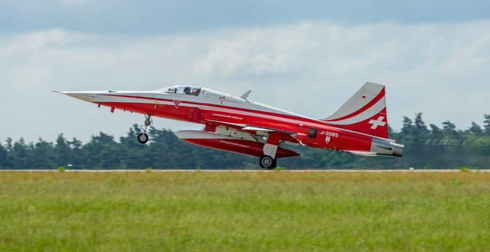 BERLIN, GERMANY - JUNI 02, 2016: Landing of jet Northrop F-5E Tiger II. The aerobatic team Patrouille Suisse. Exhibition ILA Berlin Air Show 2016