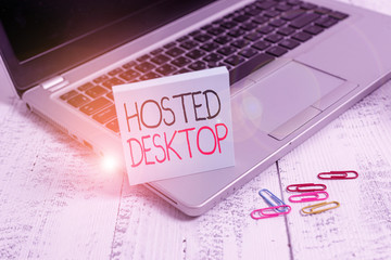 Handwriting text Hosted Desktop. Conceptual photo product set within the larger cloudcomputing sphere Trendy metallic laptop blank sticky pad clips lying wooden vintage table