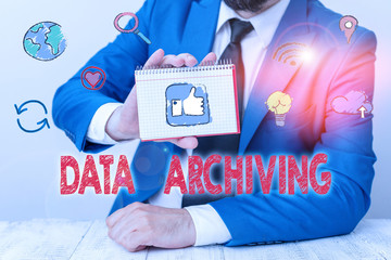 Conceptual hand writing showing Data Archiving. Concept meaning to secure and to store data for long term retention