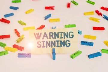Handwriting text writing Warning Sinning. Conceptual photo stop the action which is believed to...