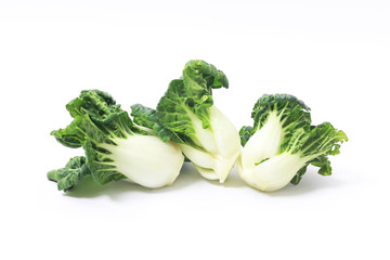 Fresh green vegetables on a white background. Organic Chinese cabbage.