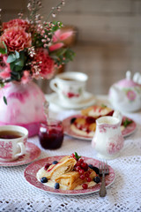 Crepes with lemon cream and raspberry jam. .selective focus.