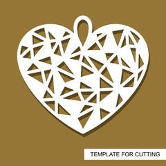Decorative pendant with  polygonal geometric heart. Decor or gift for a wedding or February 14 (Valentine's Day). Template for laser cut, wood carving, paper cutting and printing. Vector illustration.
