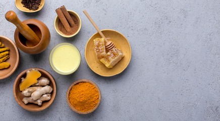 Ginger root, milk, honey, cinnamon and turmeric powder detox healthy drink